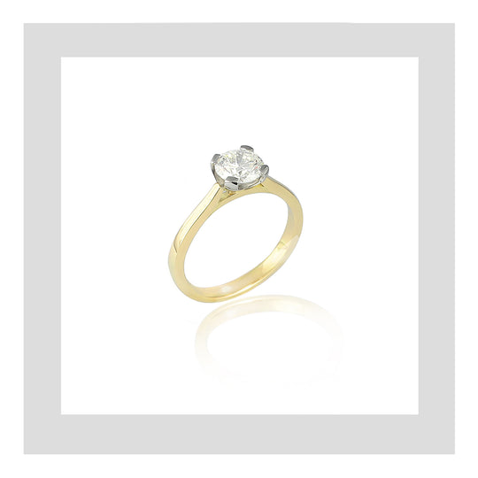 18ct yellow gold and platinum handmade engagement ring featuring a 0.70ct round diamond.